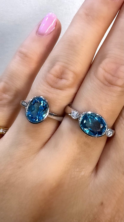 Blue Topaz Trilogy Ring Bezel Set